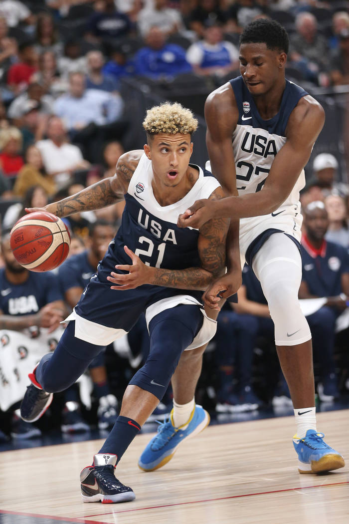 USA Men's National Team Blue forward Kyle Kuzma (21) looks to make a play under pressure from U ...