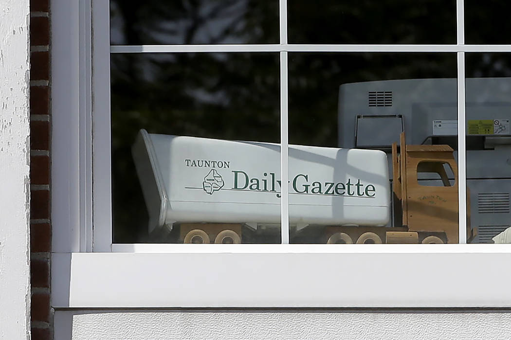 In this Monday, Aug. 5, 2019 photo a model truck sits in a window of the Taunton Daily Gazette ...