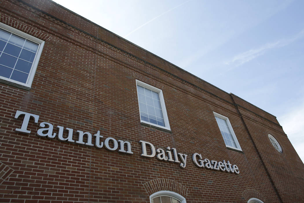 In this Monday, Aug. 5, 2019 photo a Taunton Daily Gazette sign is attached to the exterior of ...