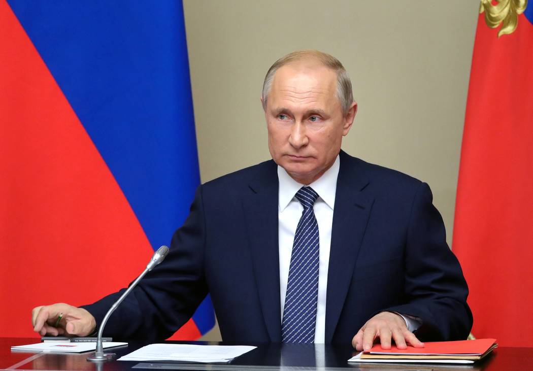 Russian President Vladimir Putin chairs a Security Council meeting in the Kremlin in Moscow, Ru ...