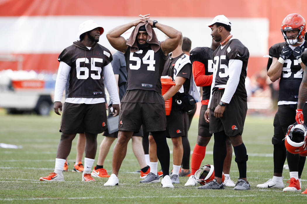 Cleveland Browns defensive tackle Larry Ogunjobi (65), outside linebacker Olivier Vernon (54) a ...