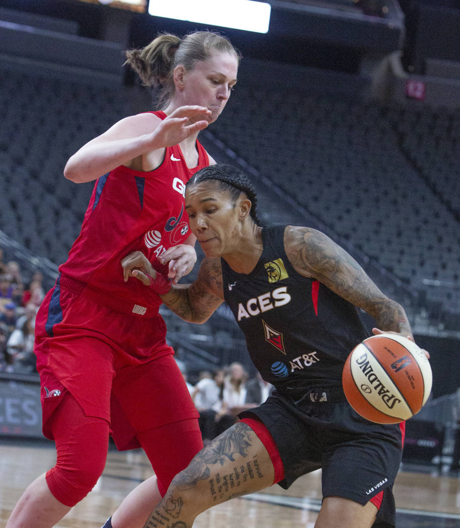 Las Vegas Aces guard Tamera Young (1) takes a step back for a two-pointer against Washington My ...