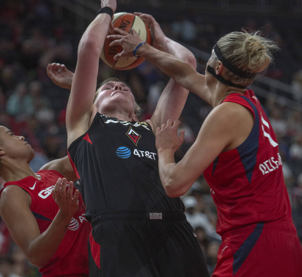 Las Vegas Aces center Carolyn Swords (4), attempts to grab the ball from a rebound against Wash ...