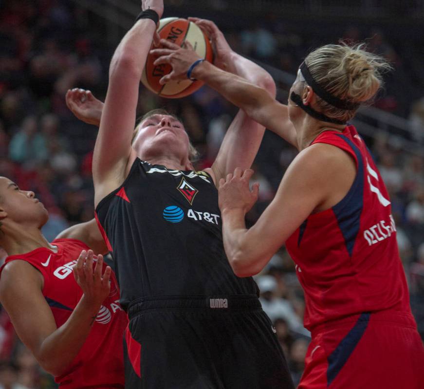 Las Vegas Aces center Carolyn Swords (4), attempts to grab the ball from a rebound against Wash ...