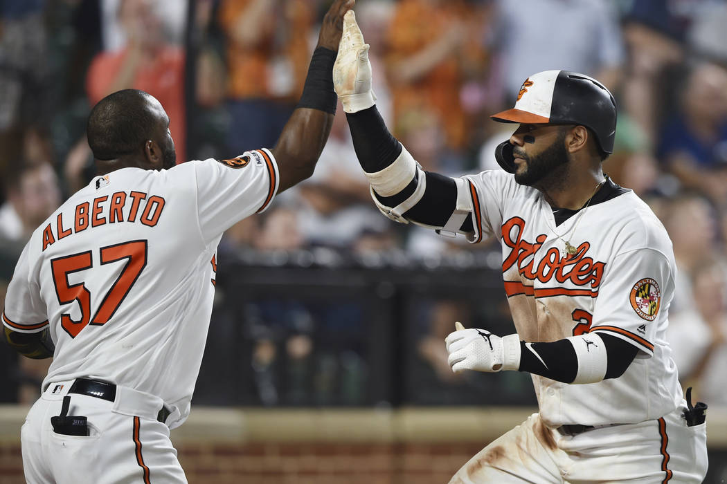 Baltimore Orioles' Jonathan Villar, right, celebrates his two-run home run with Hanser Alberto ...