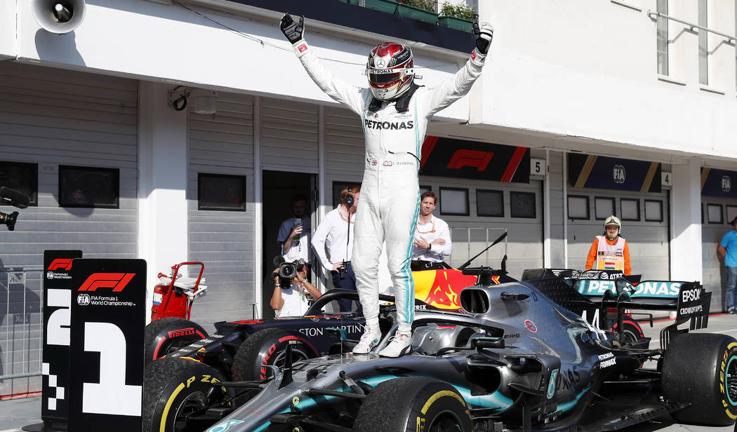 Mercedes driver Lewis Hamilton of Britain celebrates after winning the Hungarian Formula One Gr ...