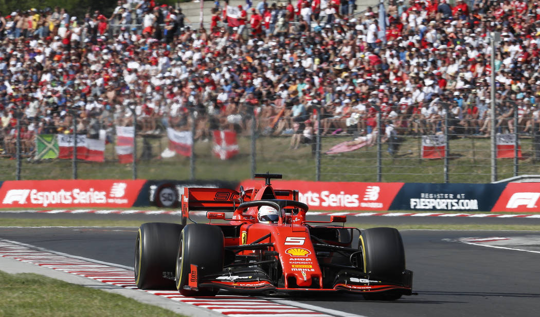 Ferrari driver Sebastian Vettel of Germany steers his car during the Hungarian Formula One Gran ...