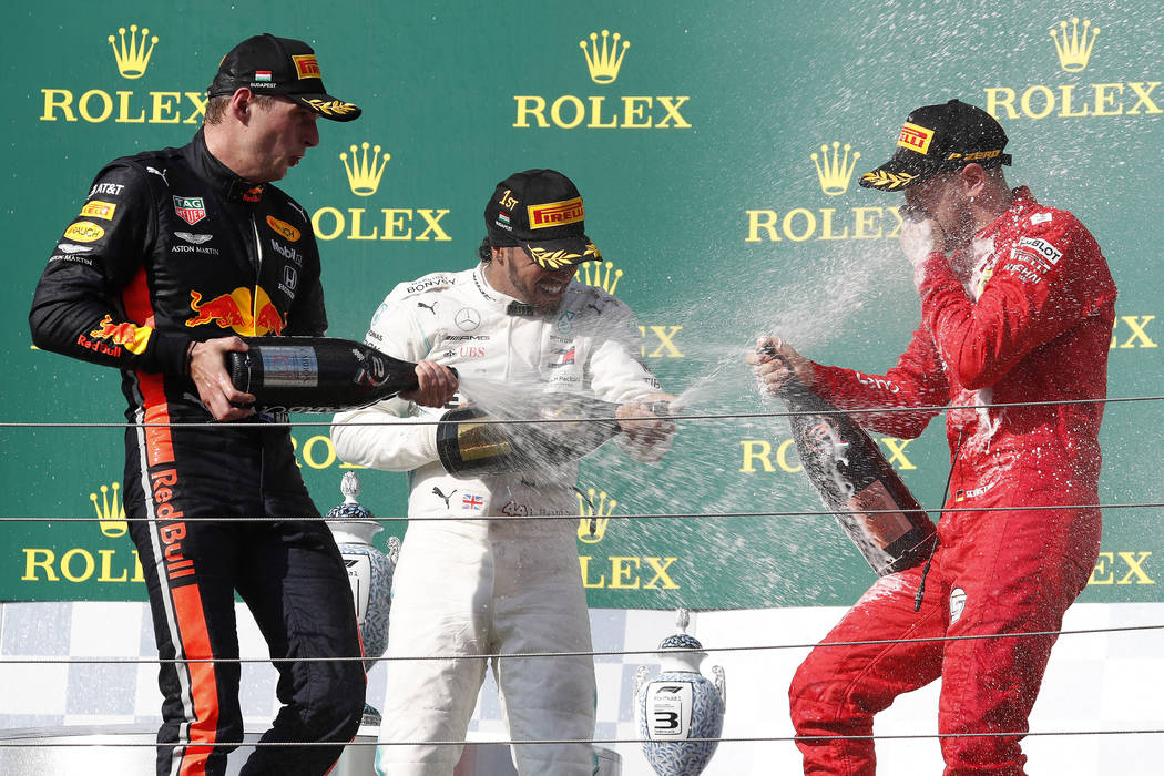 Mercedes driver Lewis Hamilton, center, of Britain, winner of the Hungarian Formula One Grand P ...