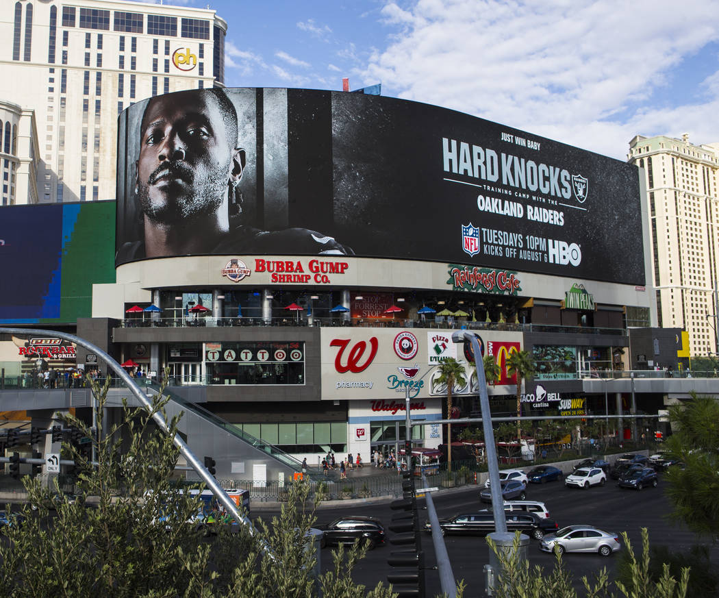 A digital billboard displays Oakland Raiders' Antonio Brown in an advertisement for the upcomin ...