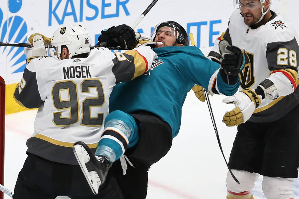 Knights left wing Tomas Nosek (92) punches Sharks defenseman Brenden Dillon (4) in the second p ...