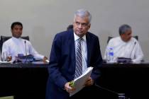 Sri Lankan Prime Minister Ranil Wickremesinghe leaves after testifying in front of a parliament ...