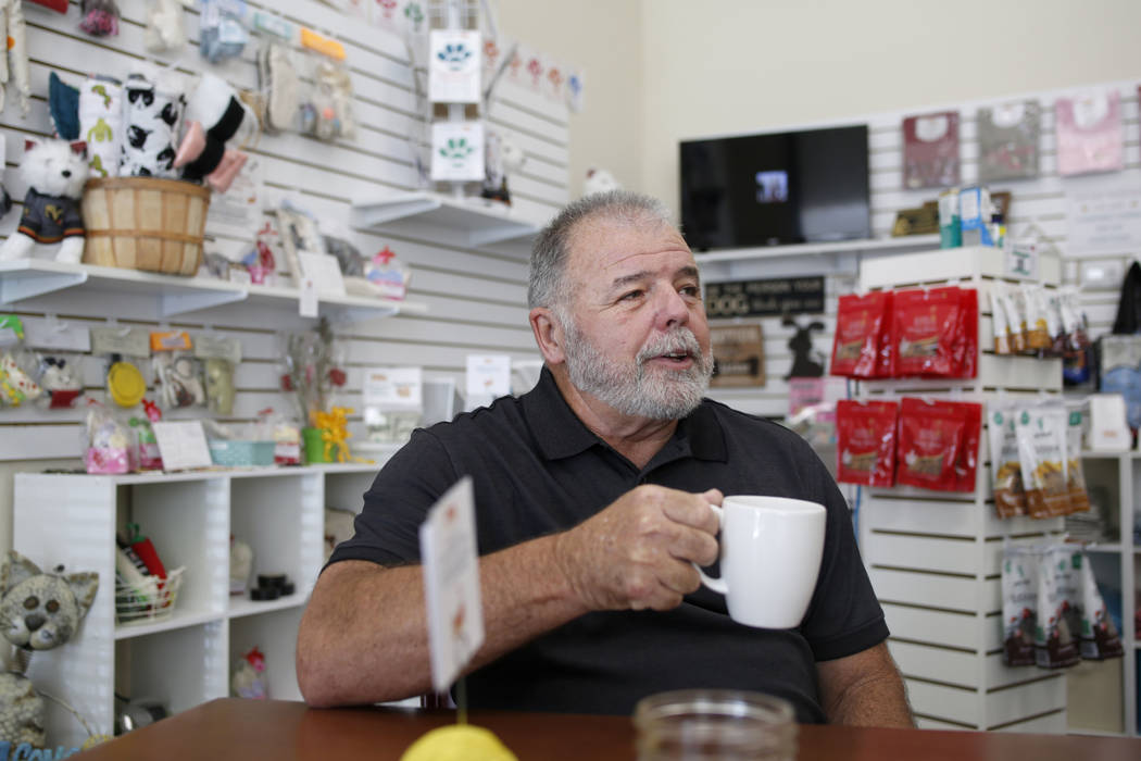 Volunteer Carl Fruge sips a cup of tea at the Rescued Treasures Cat Cafe, Tuesday, Aug. 6, 2019 ...