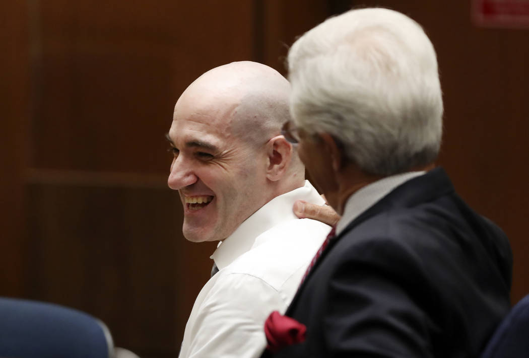 Michael Gargiulo, left, talks with his attorney Daniel Nardoni Tuesday, Aug. 6, 2019, in Los An ...