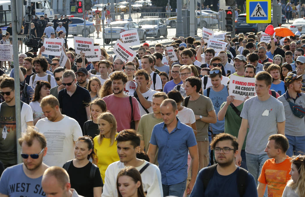 In this file photo dated Saturday, July 27, 2019, protesters hold posters that read: "I have th ...