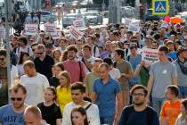 In this file photo dated Saturday, July 27, 2019, protesters hold posters that read: "I have th ...