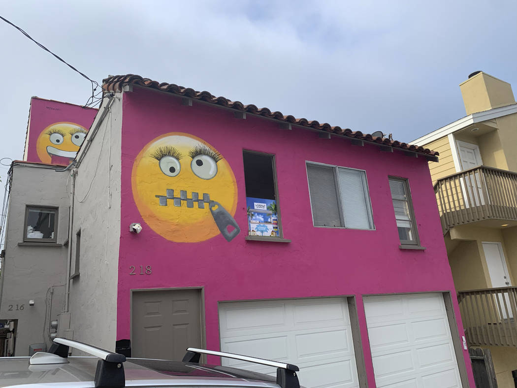 Painted emoji are seen on a house in Manhattan Beach, Calif. on Wednesday, Aug. 7, 2019. The So ...