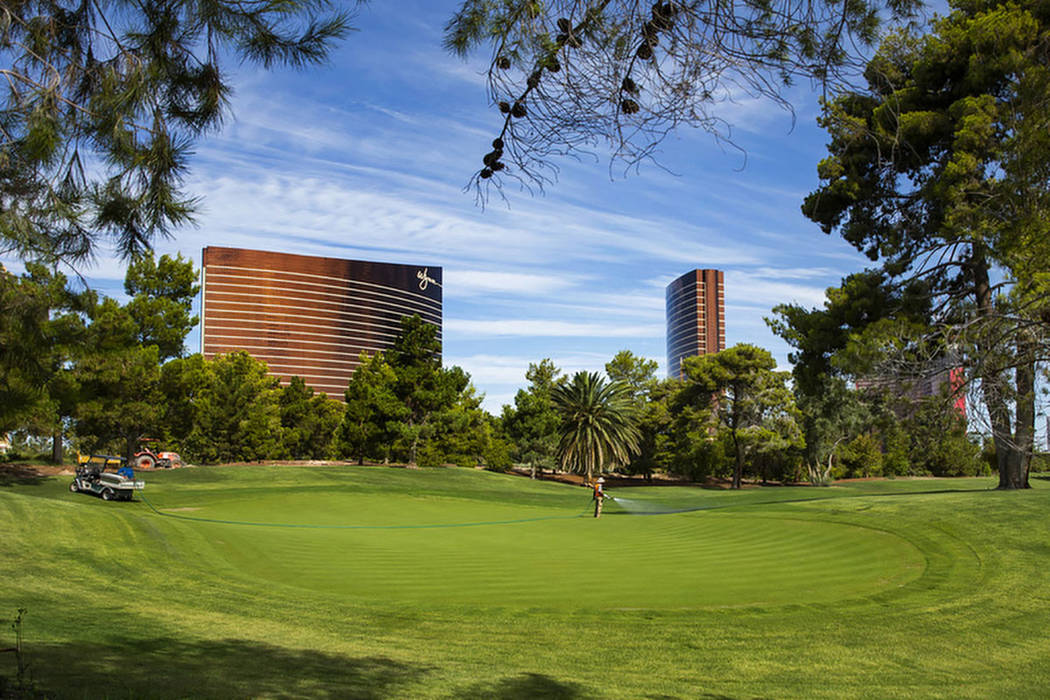 Maintenance crew water the 14th green at Wynn Golf Club on Tuesday, July 30, 2019, in Las Vegas ...