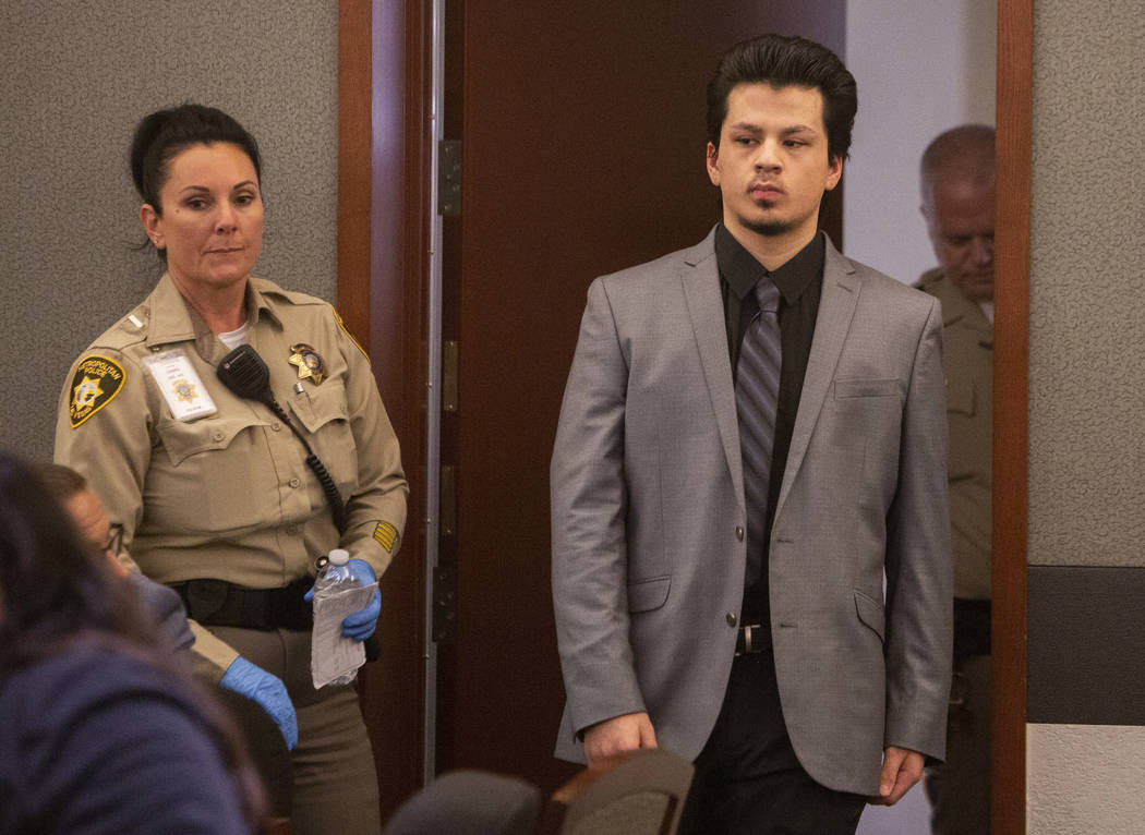 Jaiden Caruso walks back for the verdict in his murder trial at the Regional Justice Center on ...