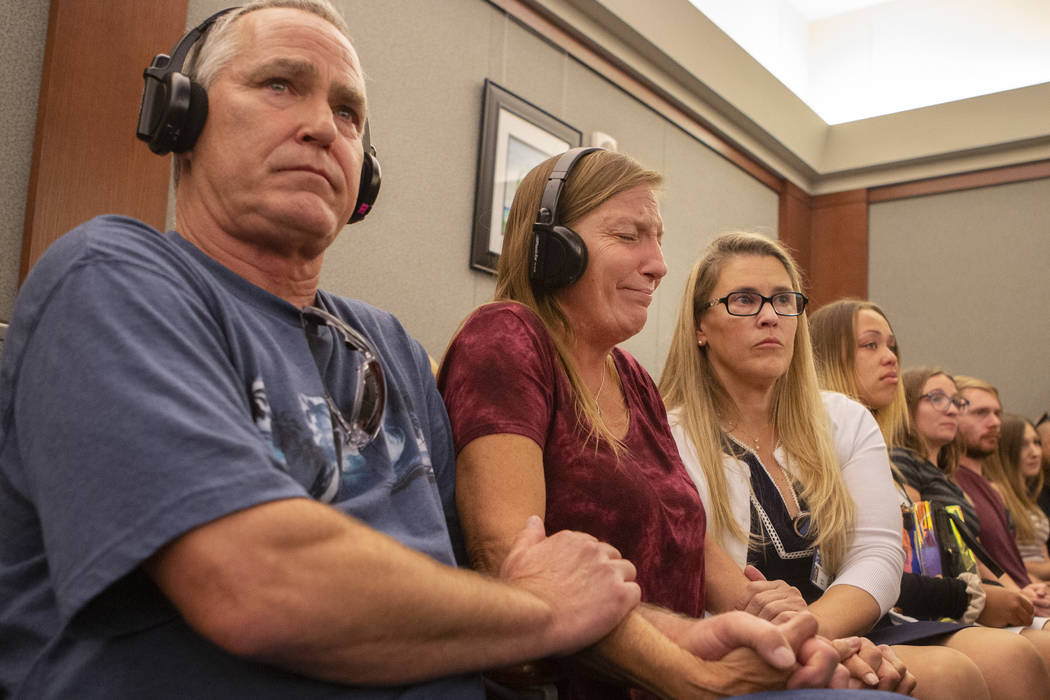 Parents Steve and Jamie Minkler are comforted by victim advocate Sara Owen while listening to t ...