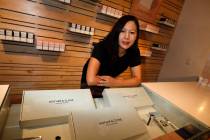 In this Friday, July 26, 2019 photo, Leslie Siu poses for a portrait next to her cannabis spray ...