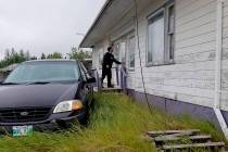 In this recent photo provided by the Royal Canadian Mounted Police, RCMP officers canvas homes ...