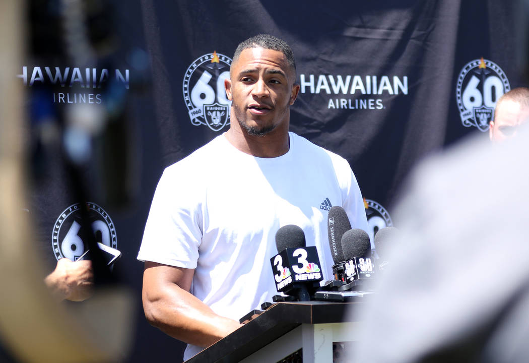Oakland Raiders safety Johnathan Abram answers questions after a joint NFL training camp practi ...
