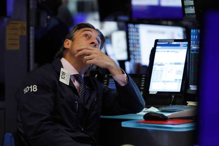 Trader John Romolo works on the floor of the New York Stock Exchange, Wednesday, Aug. 7, 2019. ...