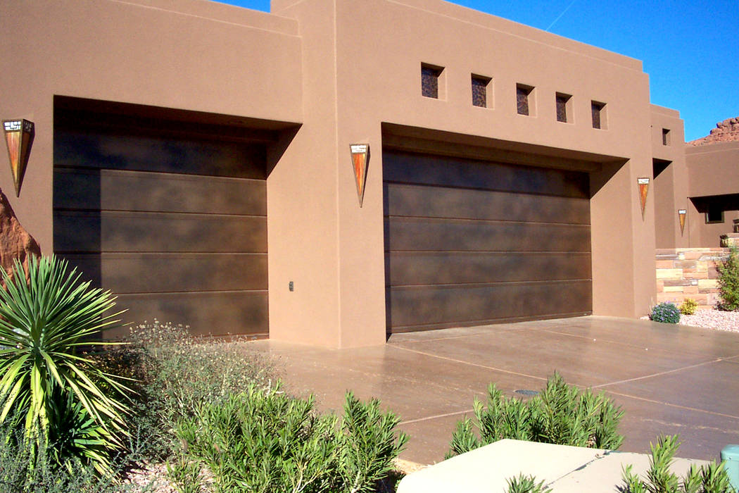 Martin Garage Door This stylish and modern home is fronted by a real copper flush-panel garage ...