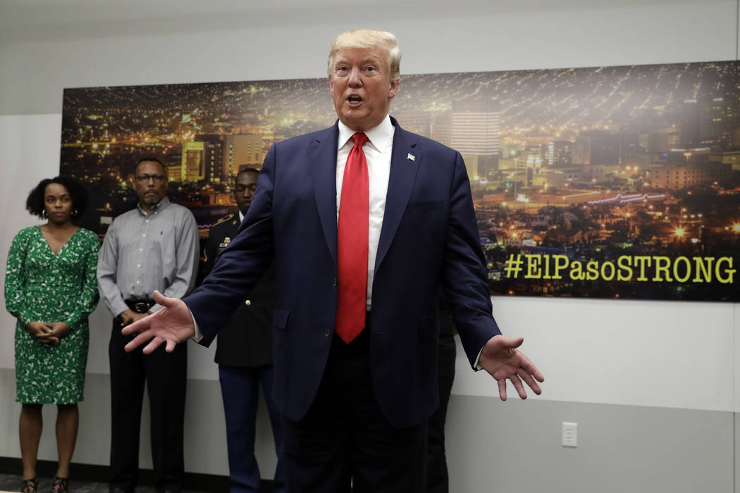 President Donald Trump speaks to the media as he visits the emergency operations center after m ...