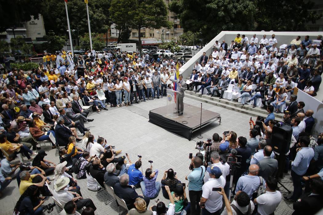 Opposition leader and self-proclaimed interim president of Venezuela Juan Guaido speaks during ...