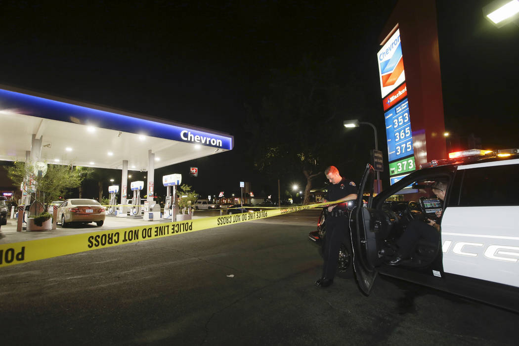 Garden Grove police stand watch at the scene of a stabbing in Garden Grove, Calif., Wednesday, ...