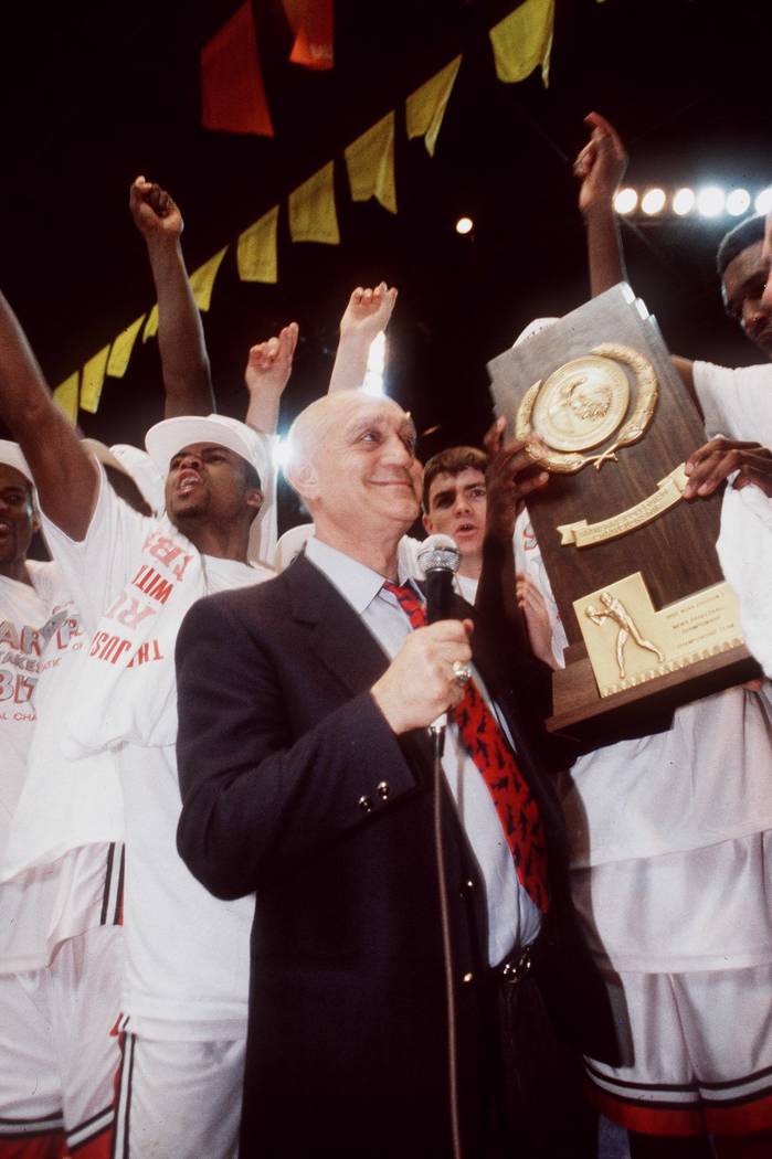 UNLV head basketball coach Jerry Tarkanian stands with his team after the Runnin Rebels won the ...