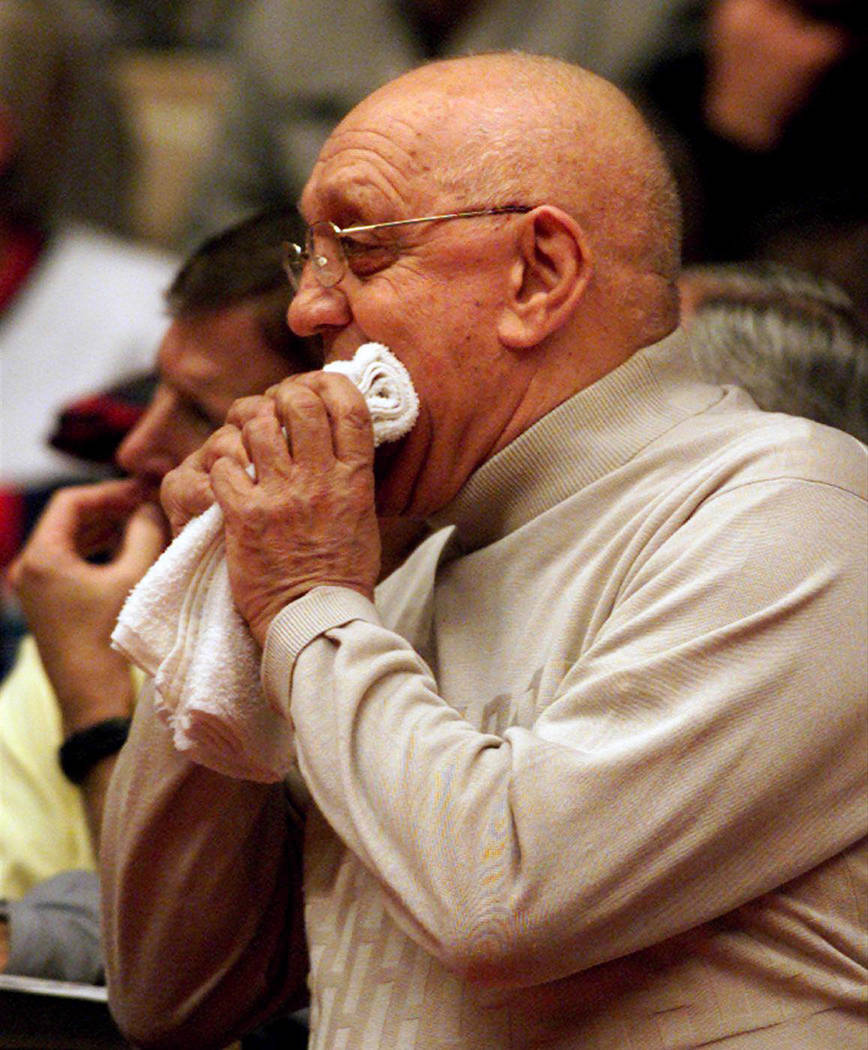 Fresno State coach Jerry Tarkanian bites a towel during their first-round NIT game against Temp ...