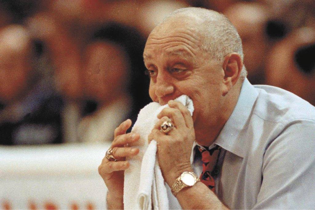 In this April 2, 1990, file photo, UNLV coach Jerry Tarkanian chews on his towel while watching ...