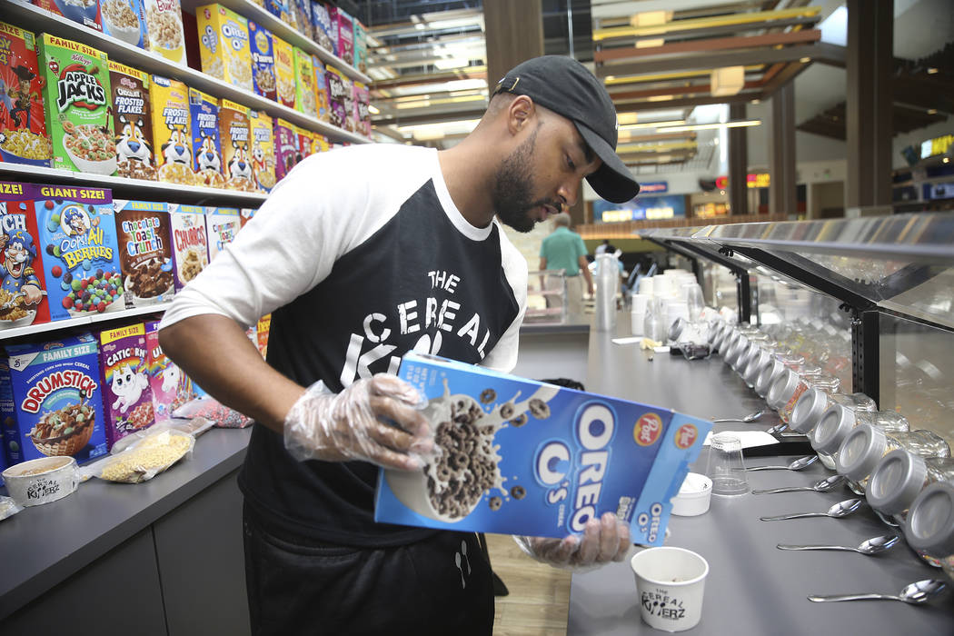 Chris Burns, owner The Cereal Killerz Kitchen, fills an order at his restaurant inside the Gall ...