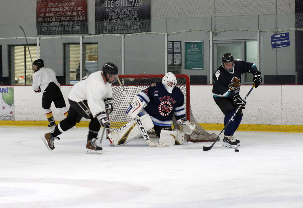 Ronnie's Hockey Club plays a pickup ice hockey game at the Las Vegas Ice Center in Las Vegas on ...