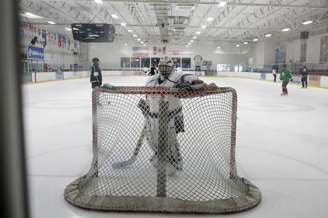 Goalie Dave Holm, 76, during Ronnie's Hockey Club, a pickup ice hockey league at the Las Vegas ...