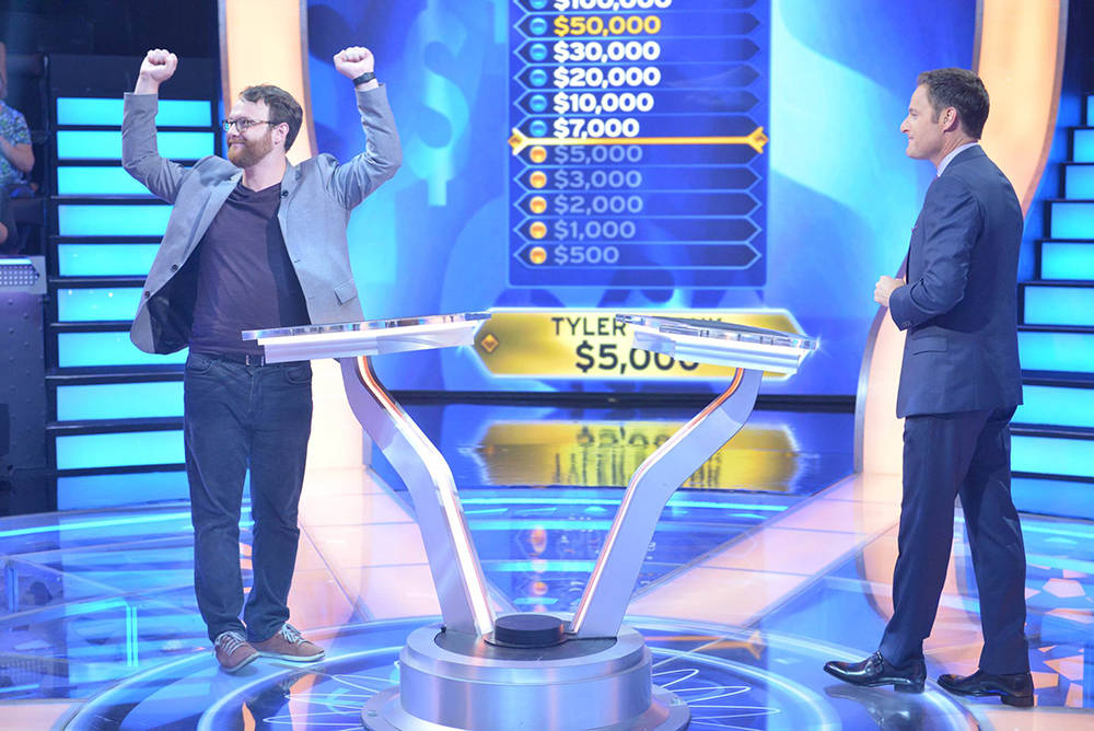 "Who Wants To Be A Millionaire" contestant Tyler Crosby celebrates as he answers the $5,000 que ...