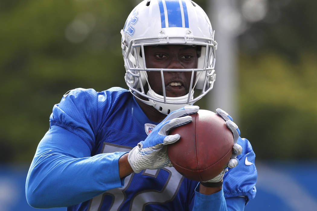 Detroit Lions tight end Brandon Barnes catches a pass during NFL football training camp in Alle ...