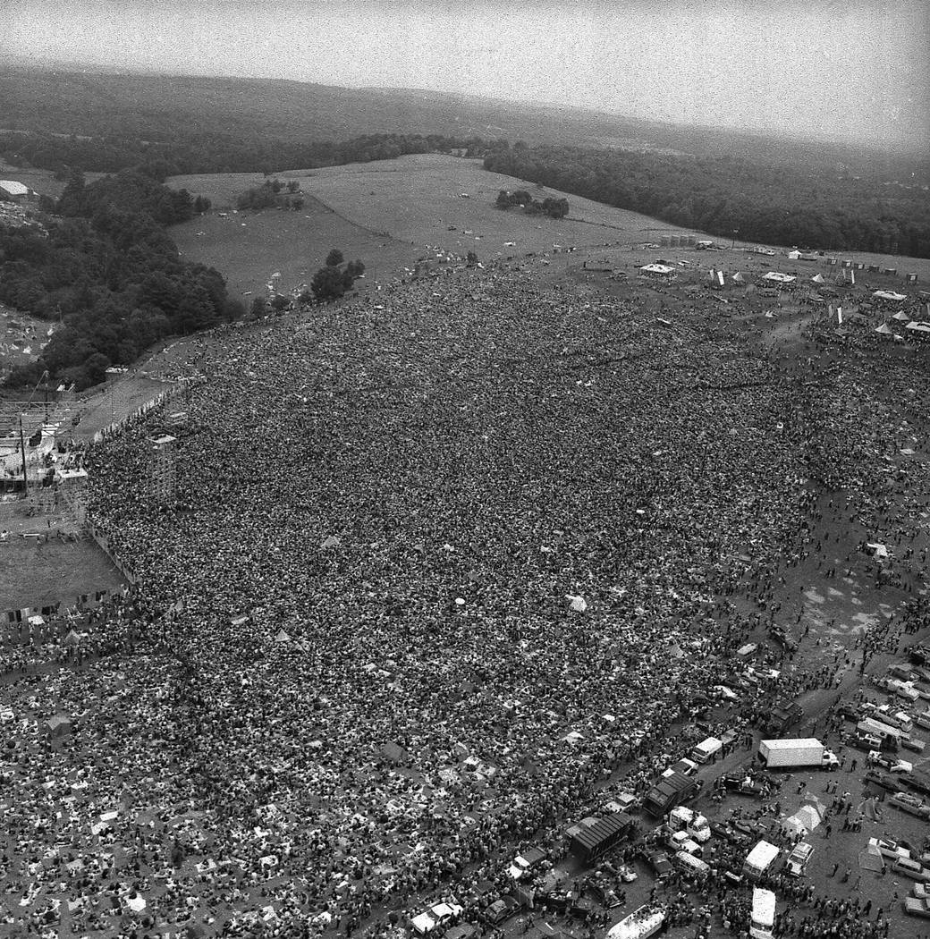 About 400,000 people attend the Woodstock Music and Arts Festival in Bethel, N.Y., August 16, 1 ...