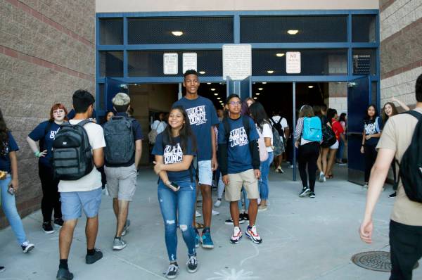 Student council members welcome fellow students on the first day of school at Liberty High Scho ...