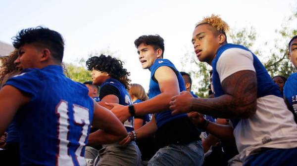 Members of the Liberty High School football team preforms a ceremonial Haka for the first day o ...