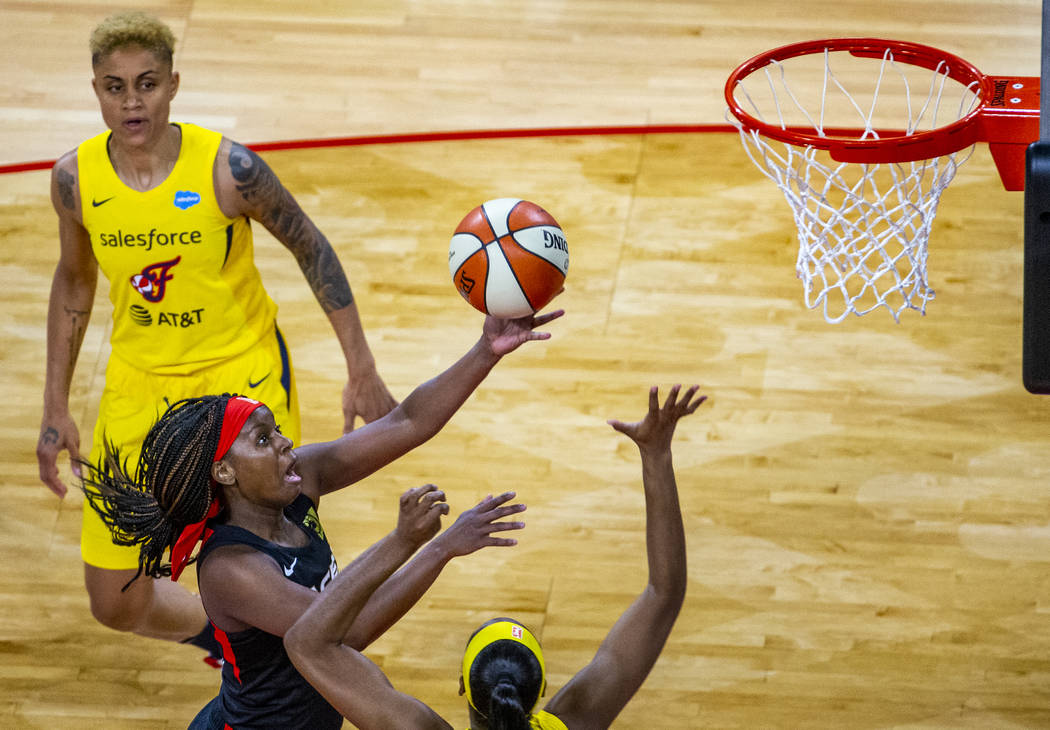 Las Vegas Aces guard Sugar Rodgers (14) rolls off a shot versus the Indiana Fever defense durin ...