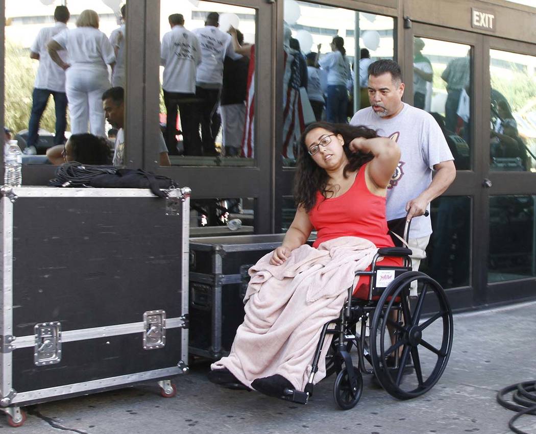 Jessica Coca Garcia is wheeled away after speaking at League of United Latin American Citizens' ...