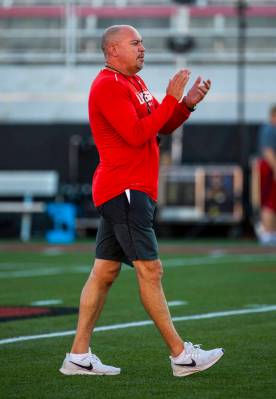 UNLV head coach Tony Sanchez is pleased by his players during their first major scrimmage of fo ...