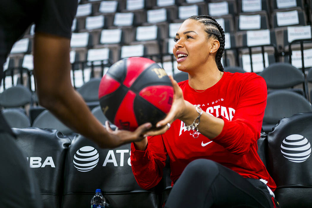 Las Vegas Aces' Liz Cambage hands a signed ball over ahead of the WNBA All-Star Game and skills ...