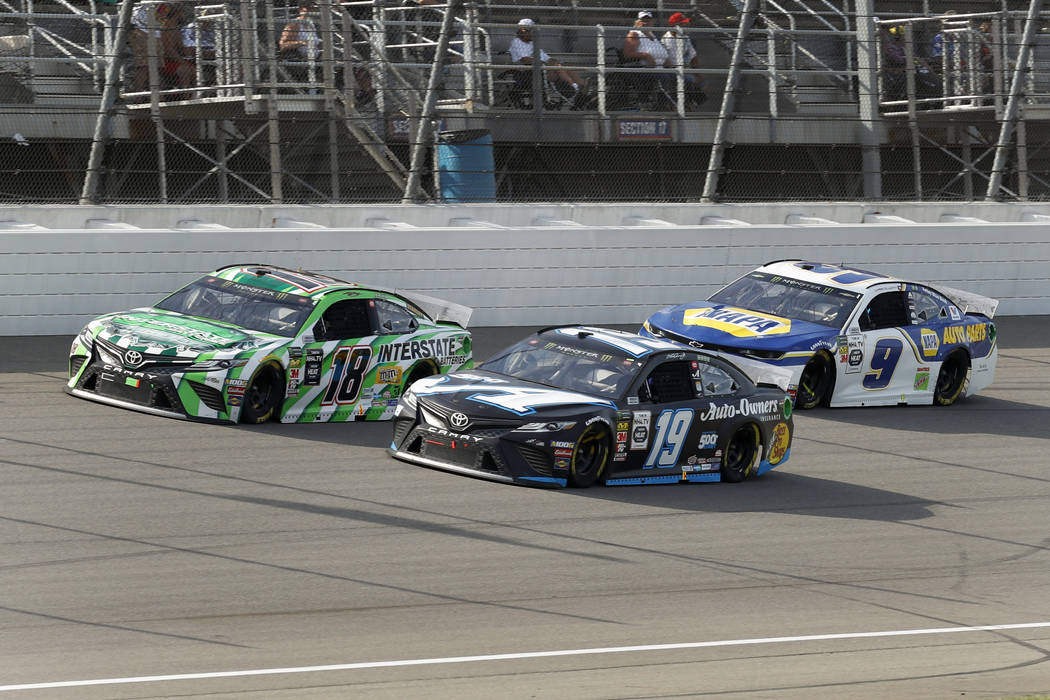 Kyle Busch (18), Martin Truex Jr. (19) and Chase Elliott (9) race during a NASCAR Cup Series au ...