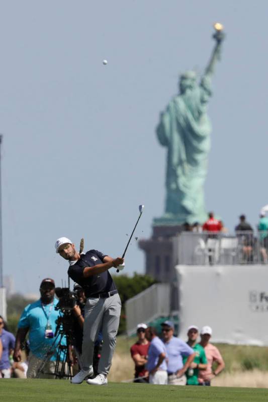 Abraham Ancer, of Mexico, hits from the third fairway in the final round in the Northern Trust ...