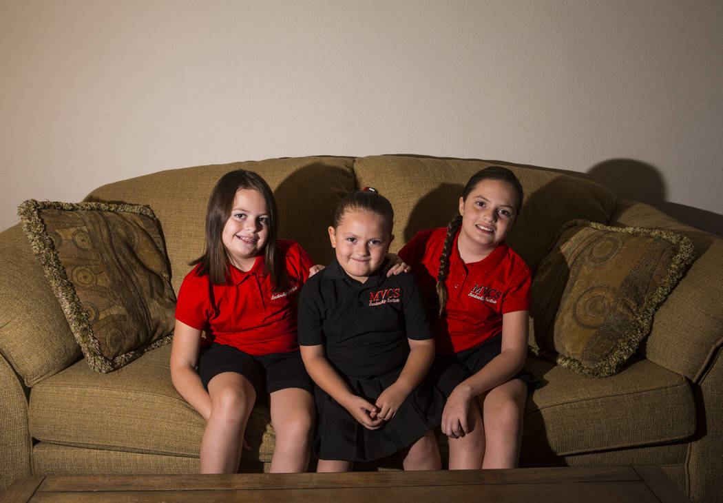Sisters, from left, Trinity Ybarra, 8, Nala Ybarra, 5, and Elia Ybarra, 9, at their home in Las ...