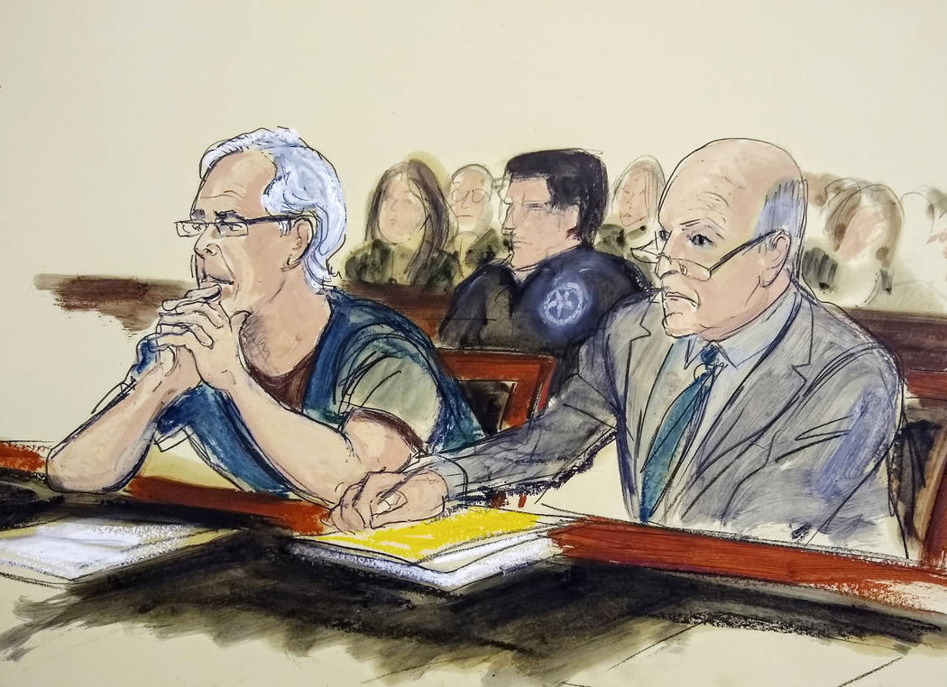 Defendant Jeffrey Epstein, left, and his attorney Martin Weinberg listen during a bail hearing ...